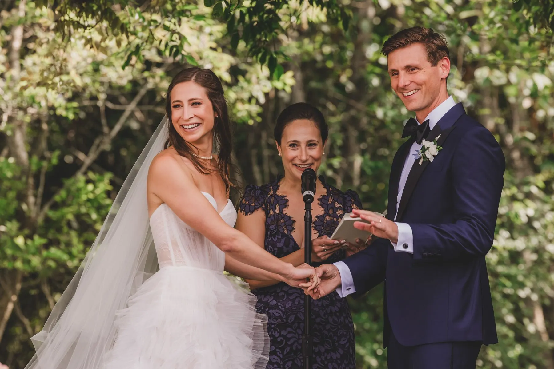 Couple exchanging vows at a garden ceremony on Nantucket