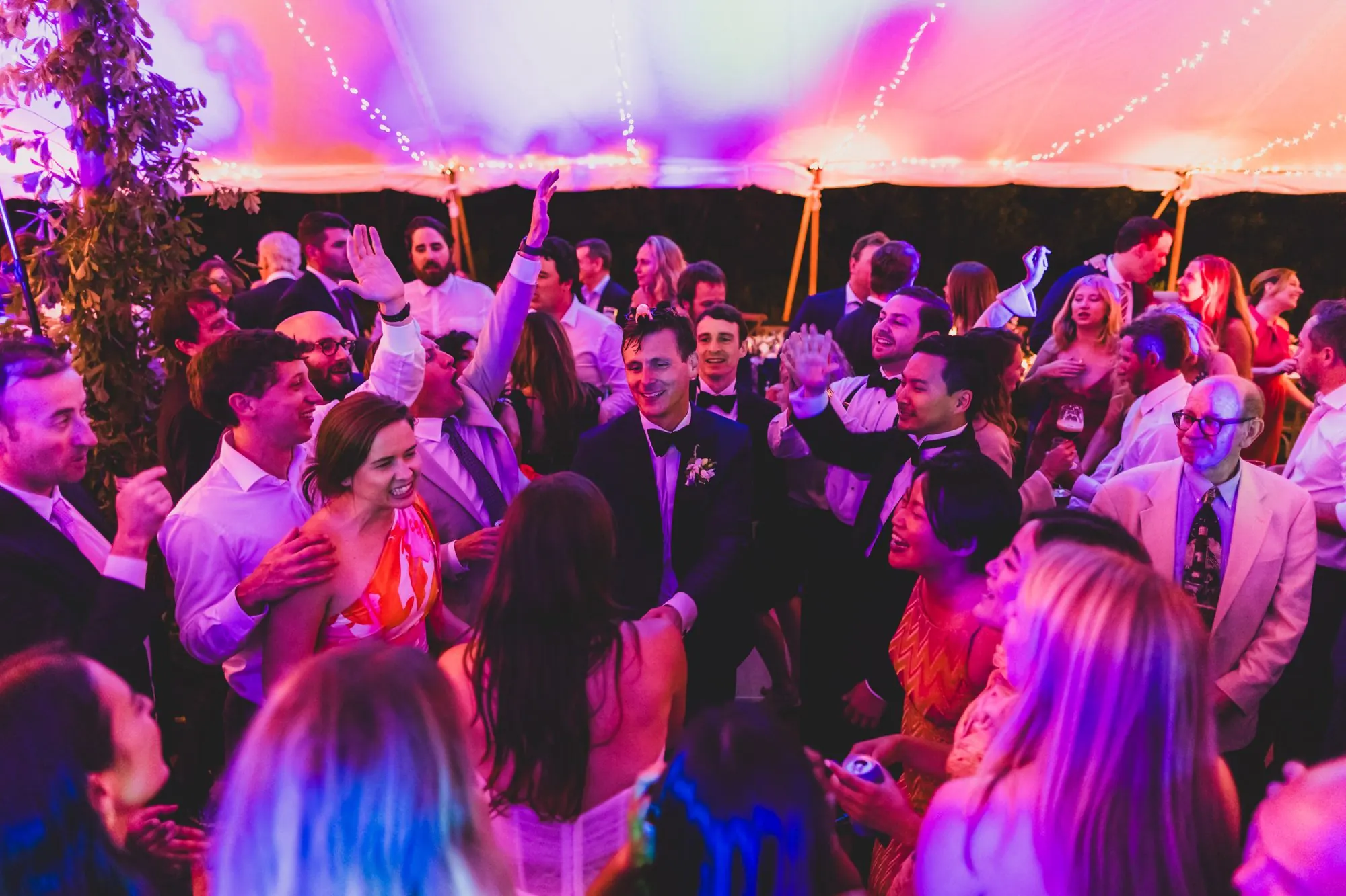 Packed dance floor under a Nantucket wedding tent with DJ Maple Syrup
