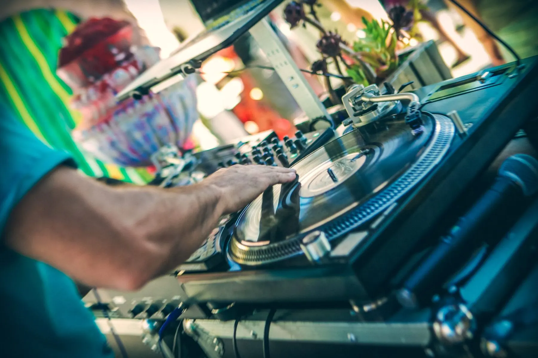 DJ Maple Syrup with a hand on the turntable